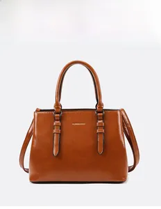 Detailed front view of the brown PU leather tote bag featuring a subtle oil wax texture