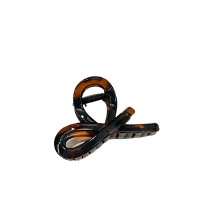 Elegant amber tortoiseshell hair claw clip for women with classic acetate finish