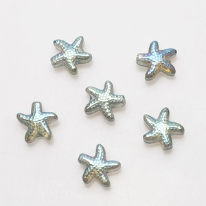 Macro shot of 6 iridescent starfish glass beads with AB coating for DIY jewelry