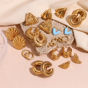 Collection of 18K gold plated hollow triangle and geometric earrings on stone base