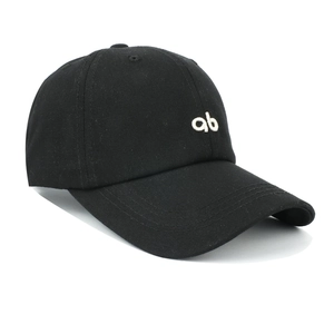 Detail of white embroidered ab letters on premium black cotton canvas baseball cap