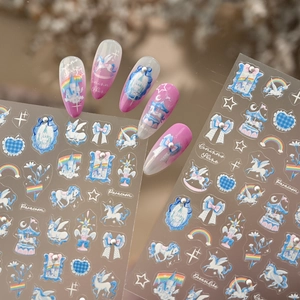 Blue and white unicorn nail stickers with rainbow and dream castle designs