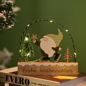 Detail of wooden Christmas gnome night light with warm LED arch and festive snow base