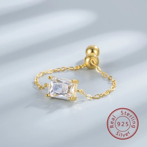 Detail view of S925 sterling silver chain ring with rectangular cubic zirconia and gold bead
