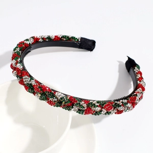 Detail of Christmas headband with red and green rhinestones and non-slip inner teeth