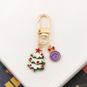 Christmas metal keychain with green enamel tree and purple decorative ball charms