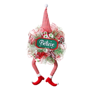 Detailed Christmas elf wreath featuring red white striped hat and Believe sign on white background