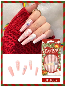 Detailed view of pink and white Christmas press-on nails with reindeer and snowflake patterns