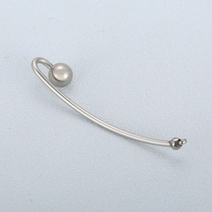 Sleek silver stainless steel curved barbell piercing with ball and ring eyelet