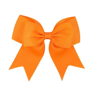 Detailed macro view of orange grosgrain ribbon bow with neat swallowtail cut ends