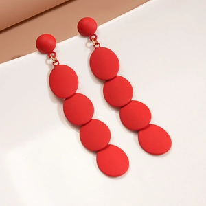 Matte red geometric drop earrings with five cascading round discs in a bold modern style