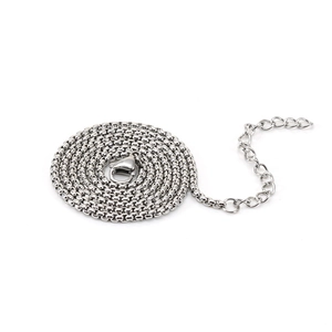 Close-up of silver stainless steel box chain necklace with lobster clasp and extender
