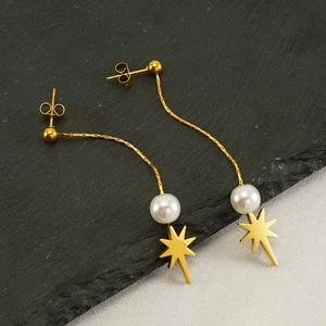 Elegant gold long tassel star earrings with pearls and polished metal finish