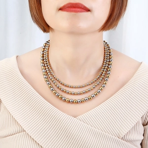 Three-layer layered bead necklace in polished gold and silver stainless steel design