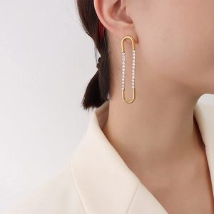 U-shaped gold-plated titanium steel earrings with white zircon on professional model