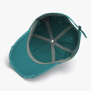 Distressed dark blue cotton baseball hat with adjustable strap and vintage frayed edge