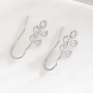 Macro shot of minimalist silver double interlocking hoops earrings with long hooks