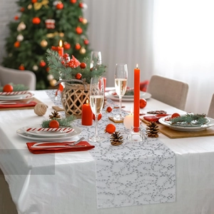 Detail of white mesh table runner with grey gold-stamped star patterns for festive decor