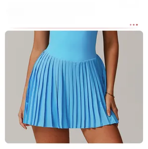 Detailed close-up of blue pleated tennis skirt with high-waisted athletic stitching