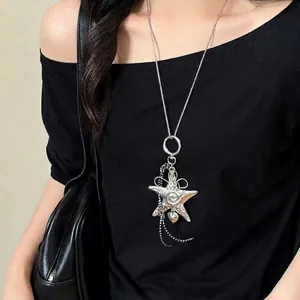 Detail of vintage silver starfish pendant necklace with relief textures on model
