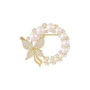Elegant gold butterfly brooch with white pearls and sparkling crystal zircons