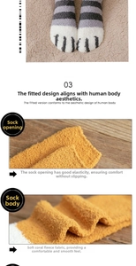 Detail of soft coral fleece socks showing striped pattern and elastic ribbed cuffs