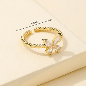 Adjustable golden bow ring with sparkling zircons and twisted band for women