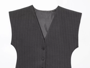 Detail of dark grey pinstripe V-neck vest featuring a classic button-down sleeveless design