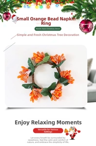 Detail of small orange berry napkin ring with green leaves for holiday table decor