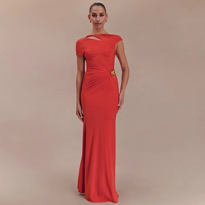 Detail of red slim-fit maxi dress featuring elegant waist pleats and gold buckle