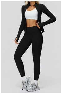 Detailed view of high-waist yoga pants and slim black sports jacket on model