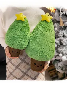 Detailed plush Christmas tree pillows in two sizes with festive star and soft texture