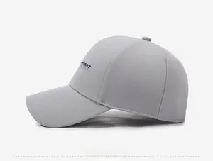 Side view of gray baseball cap featuring premium embroidered lettering on breathable fabric