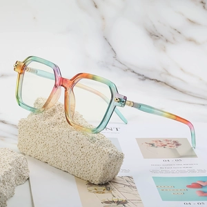 Fashionable gradient oversized square sunglasses for women on a marble textured background