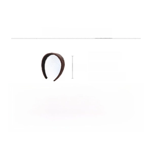 Close-up of brown quilted leather headband with size details 15cm height and 35.5g weight