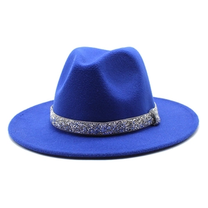 Detailed shot of royal blue wool fedora hat featuring a sparkling silver rhinestone band