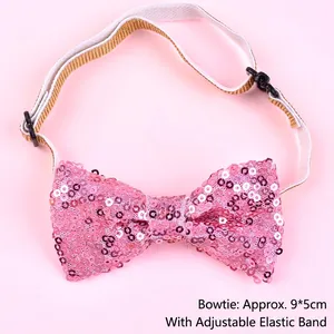 Close-up of pink sequined bow tie with an adjustable elastic strap for pet birthdays