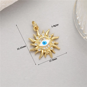 Macro view of 14K gold plated sun evil eye charm with blue enamel and dimensions