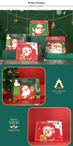 Detail of festive Santa Claus gift boxes with ergonomic metallic handles and holiday motifs