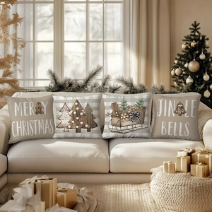 Set of four linen Christmas pillow covers featuring snowmen and festive patterns on a sofa