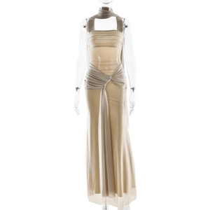 Detail of champagne glitter evening dress featuring a halter neck and waist cutout