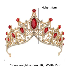Golden Baroque bridal crown with red rhinestones and white crystals on white background