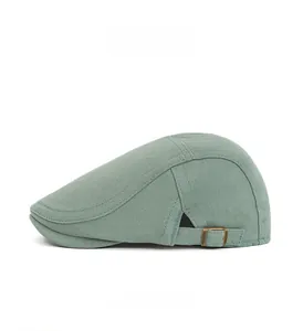 Detailed side view of mint green ivy cap showing adjustable metal buckle and stitching
