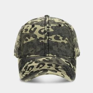 Detailed close-up of a vintage washed camouflage baseball cap with leopard print texture