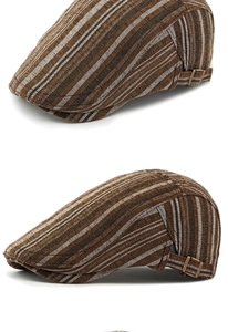 Détail d'une casquette rétro à rayures avec boucle en bronze et tissu texturé