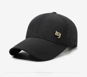 Detail view of black breathable quick-dry baseball cap with laser-cut holes and gold logo