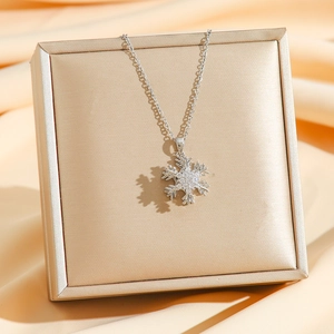 Elegant rotating snowflake pendant necklace in silver titanium steel with crystals