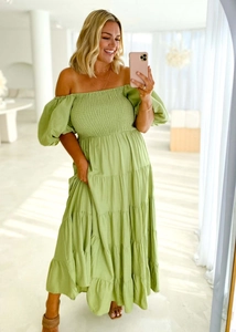 Detail of puff sleeves and layered tiered skirt on a green off-shoulder maxi dress