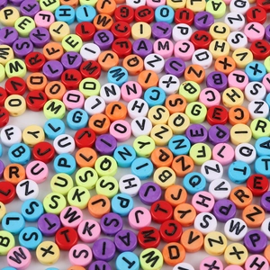 Macro shot of colorful 4x7mm acrylic alphabet beads for DIY jewelry and bracelets
