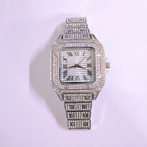 Detail of luxury silver square watch featuring full crystal pavé dial and Roman numerals